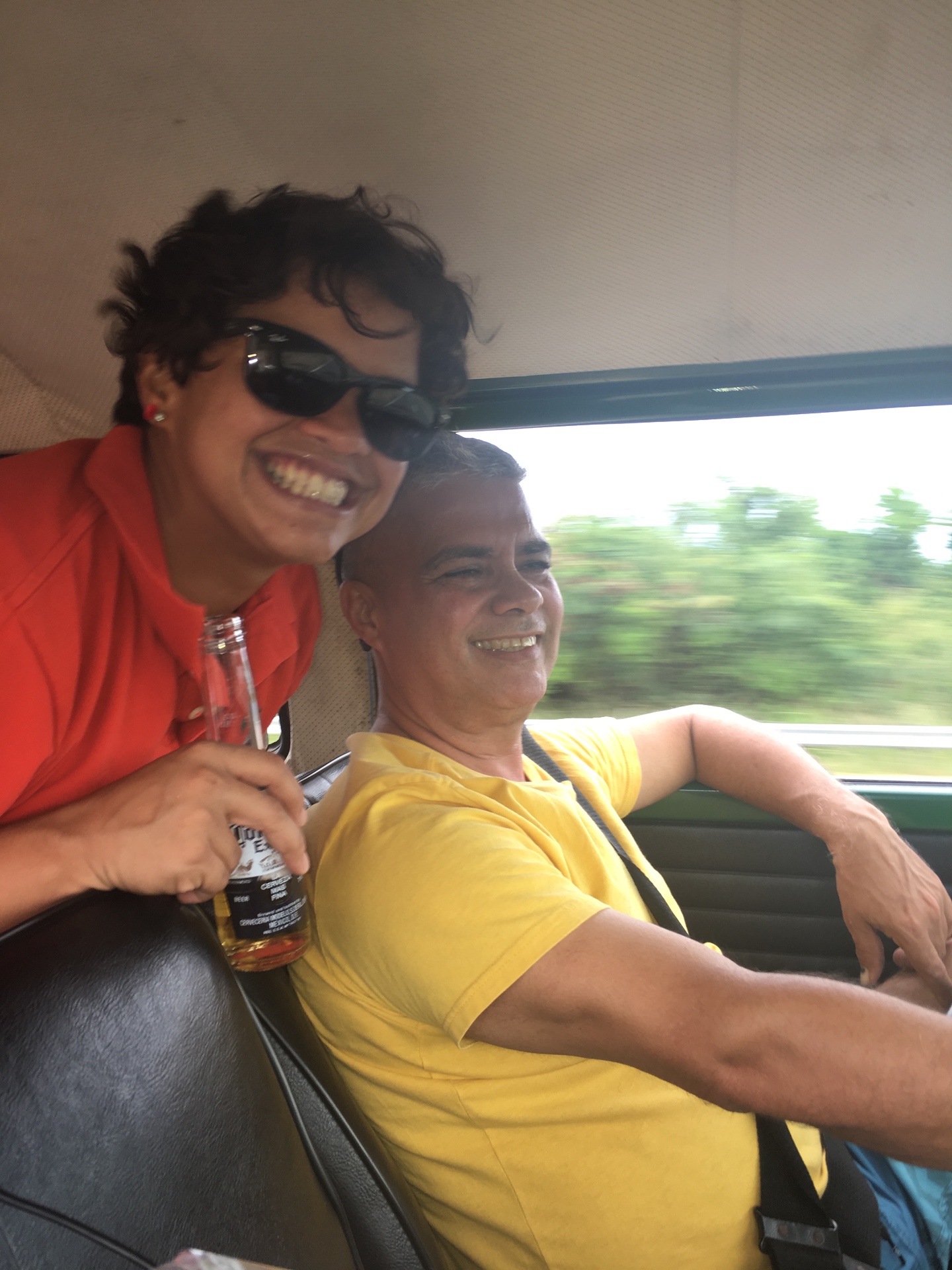 Nolo and his father laughing together on a drive in Puerto Rico